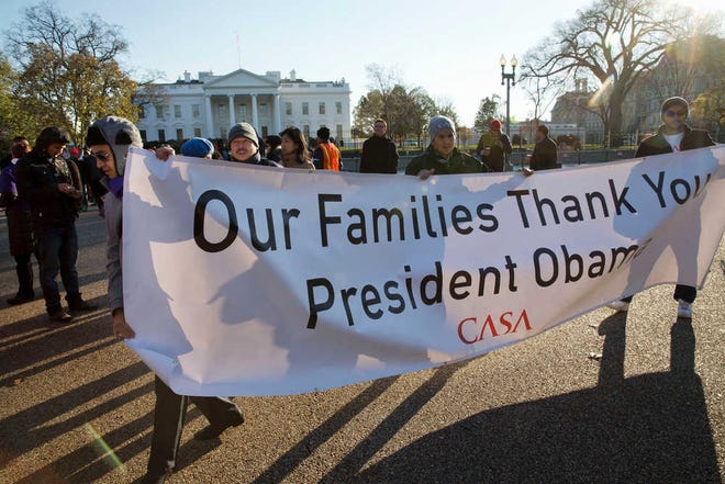 FILE - In this Nov. 21, 2014 file photo, supporters of immigration reform attend a rally in front of the White House in thanking President Obama for his executive action on illegal immigration. A Congress that began with bright hopes for immigration legislation is ending in bitter divisions on the issue even as some Republicans warn that the political imperative for acting is stronger than ever for the GOP. In place of a legislative solution, President Barack Obama's recent executive action to curb deportations for millions here illegally stands as the only federal response to what all lawmakers agree is a dysfunctional immigration system. Many Democrats are convinced Latino voters will reward them for Obama's move in the 2016 presidential and Senate elections, while some Republicans fear they will have a price to pay. (AP Photo/Jacquelyn Martin, File)