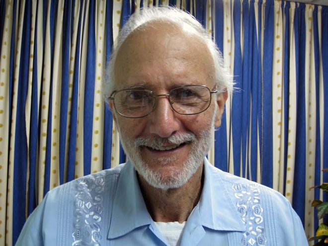 In this Nov. 27, 2012, photo provided by James L. Berenthal, jailed American Alan Gross poses for a photo during a visit by Rabbi Elie Abadie and U.S. lawyer James L. Berenthal at Finlay military hospital as he serves a prison sentence in Havana, Cuba.