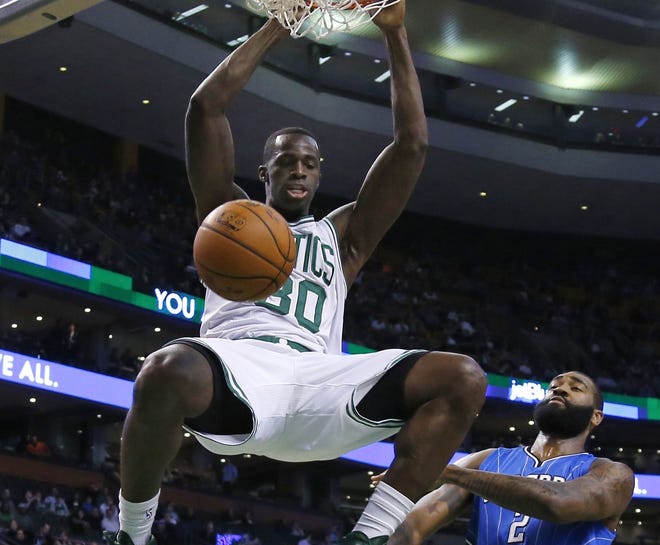 Celtics forward Brandon Bass (30) dunks during the second half of Boston's 109-92 win over the Magic on Wednesday night.