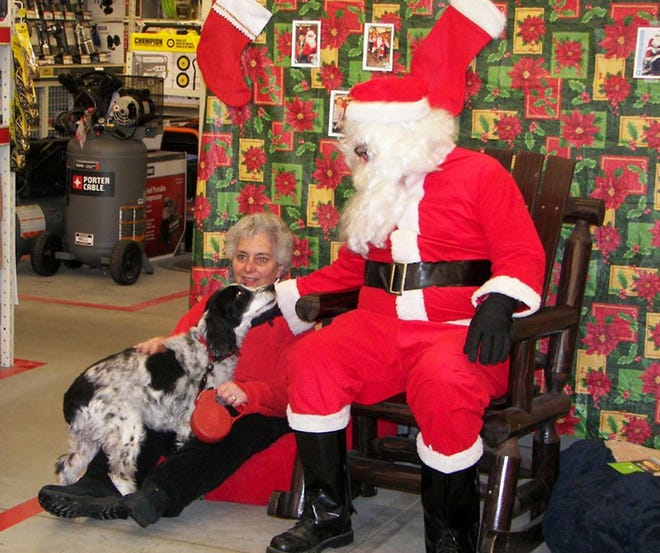 Area resident Lurena McNamara and her dog, Suzie, were among the visitors who stopped at the Tractor Supply Store on Dec. 6 for the Madison FFA's annual Picture Your Pet with Santa Day.