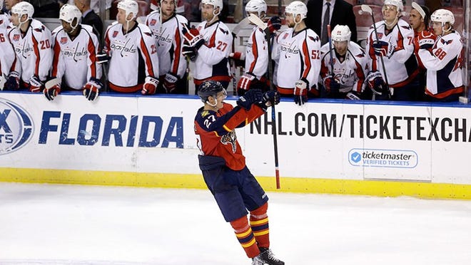 Florida Panthers center Nick Bjugstad (27) celebrates after scoring the game-winning goal in a shootout of an NHL hockey game against the Washington Capitals, in Sunrise, Fla., Tuesday, Dec. 16, 2014. Bjugstad's goal came in the 20th round — on the 40th shot of the shootout, the longest shootout in NHL history. The Panthers won 2-1. (AP Photo/Alan Diaz)