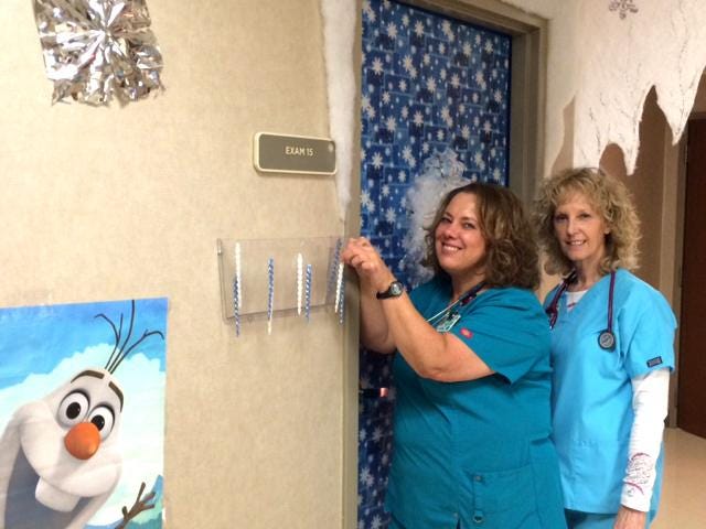 Photo submitted by Holli Helms
Beth Minter and Cynthia Smith put the finishing touches on holiday decorations at the Shelby Children's Clinic. The staff at Shelby Children’s Clinic, a part of Carolinas HealthCare System, decked the halls to bring a little holiday joy into the lives of their patients.