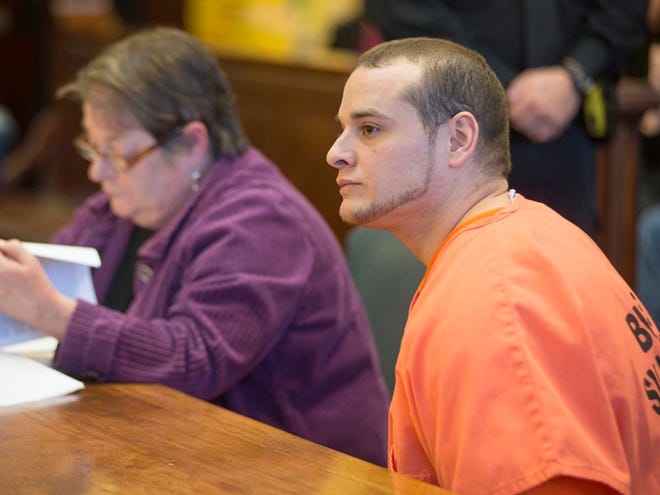 Matthew Blaz, 33, right, is sits at a table with his defense attorney, Deirdre Caughlan, during his sentencing in district court on Nov. 13 in Butte, Mont. Blaz was sentenced to life in prison without parole for the death of his infant daughter Mattisyn Blaz.
