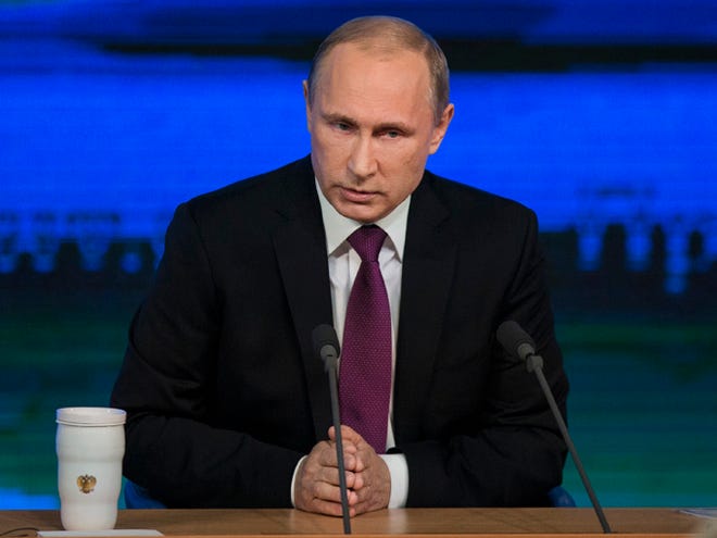 Russian President Vladimir Putin speaks during his annual news conference Thursday in Moscow, Russia. Putin says Russia has sufficient currency reserves and the ruble will recover.