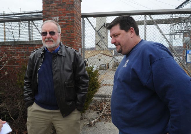 Somerset Town Administrator Dennis Luttrell and Selectman Scott Lebeau talk at the old Montaup power plant site in this file photo.