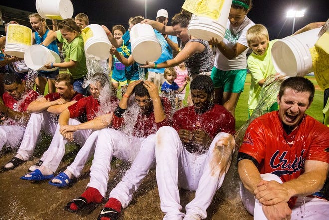 Peoria Chiefs players participate in the ALS ice bucket challenge on Aug. 22 after winning their baseball game against the Wisconsin Timber Rattlers at Dozer Park.