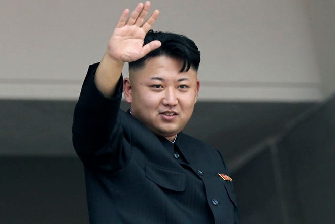 In this July 27, 2013 file photo, North Korea's leader Kim Jong Un waves to spectators and participants of a mass military parade celebrating the 60th anniversary of the Korean War armistice in Pyongyang, North Korea. If the U.S. government’s claim that North Korea was involved in the unprecedented hack attack on Sony Pictures that scuttled Seth Rogen’s latest comedy is correct, no one can say they weren’t warned. The movie, “The Interview,” pushed all of North Korea’s buttons. (AP Photo/Wong Maye-E, File)