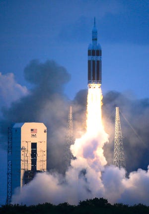 The NASA Orion space capsule atop a Delta IV rocket, in its first unmanned orbital test flight, lifts off from the Space Launch Complex 37B pad at the Cape Canaveral Air Force Station, Friday, Dec. 5, 2014, in Cape Canaveral, Fla.