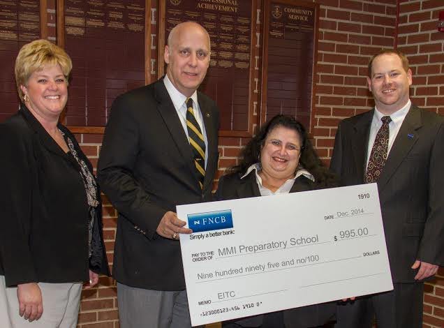 Representatives from FNCB recently presented a contribution made through the Education Improvement Tax Credit program to MMI Preparatory School. At the presentation from left are Kim McNulty, MMI Director of Advancement; Thomas G. Hood, MMI Head of School; Nicoline Evans, FNCB community office manager; and Frank Kost, Assistant Vice President of Application Services.

Photo provided