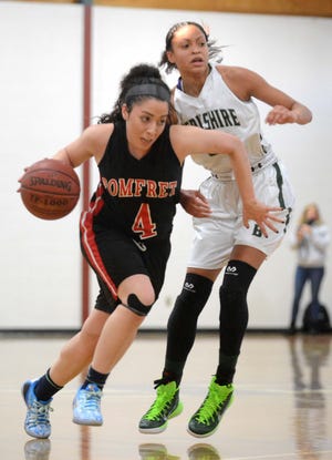 Pomfret School’s Rebecca Erosa gets by Berkshire School’s Samone DeFreese Thursday during their game at the New England Girls’ Basketball Classic in Pomfret. Pomfret lost the game, 57-29, but beat Kent later that night. Aaron Flaum/ NorwichBulletin.com