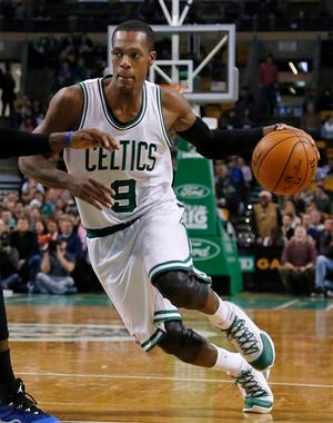 In this Wednesday, Dec. 17, 2014 photo, Boston Celtics guard Rajon Rondo (9) drives during the second half of an NBA basketball game against the Orlando Magic in Boston. The Celtics traded point guard Rajon Rondo to Dallas on Thursday night, Dec. 18, 2014, cutting ties with the last remnant of Boston's last NBA championship while giving Dirk Nowitzki and the Mavericks a chance at another title.