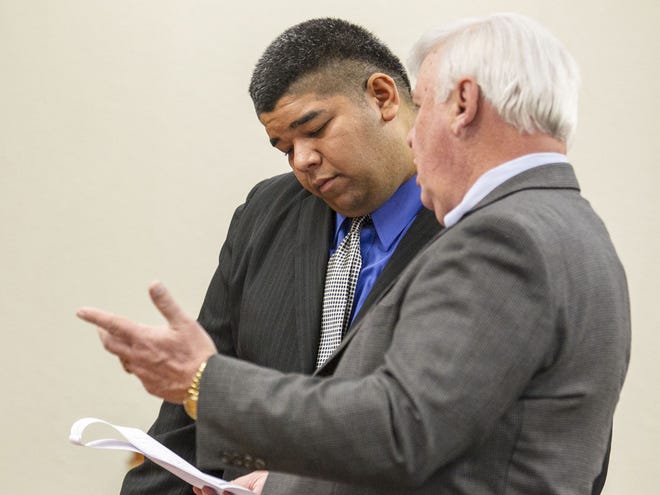 Rishi Ramgooli, left, goes over court documents with his Criminal Conflict and Civil Regional Council attorney Michael Reiter before he pleads no contest to felony fleeing and eluding at the Marion County Judicial Center on Friday.