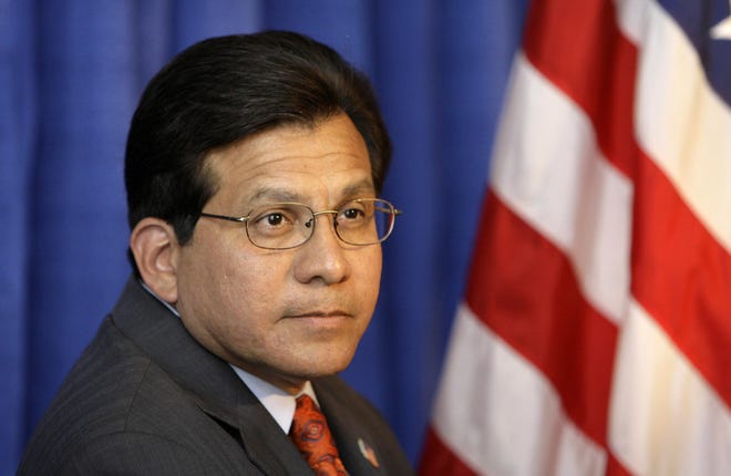 FILE - In this Aug. 28, 2007 file photo, then-Attorney General Alberto Gonzales is seen in New Orleans. A Senate investigation portrays a dysfunctional relationship between the Bush White House and the CIA regarding the agency's brutal interrogation program. The report says the White House didn't press hard for information, and the agency withheld details about the brutality of the techniques while exaggerating their effectiveness. Alberto Gonzales is the former attorney general who was White House counsel when harsh CIA interrogations were approved. Gonzales tells The Associated Press it was not the White House's responsibility to manage the program. (AP Photo/Alex Brandon, File)