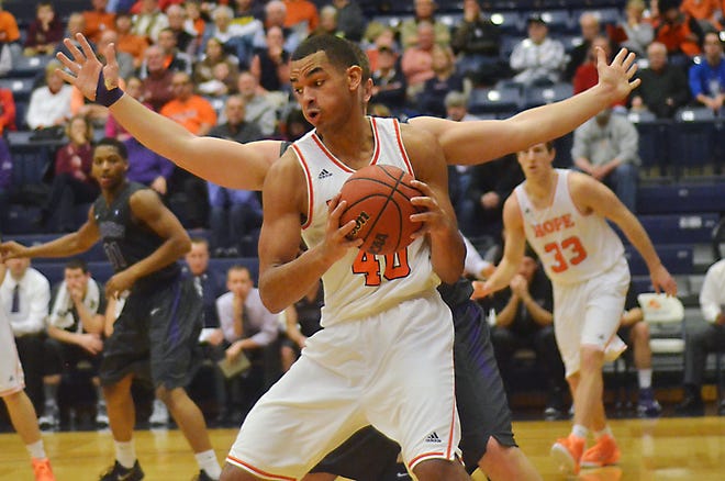 Hope College junior Brock Benso nmakes a move in the post during the Holland Sentinel/Russ DeVette Classic on Saturday at DeVos Fieldhouse. Hope defeated Mount Union 79-71 and Benson took home the MVP of the tournament. Andrew Whitaker/Sentinel Staff
