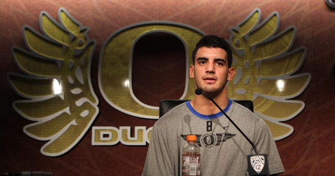 Marcus Mariota meets the media for the first time after returning to Eugene from his whirlwind Heisman Trophy ceremony. (Chris Pietsch/The Register-Guard)