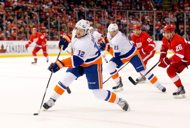 Islanders left wing Josh Bailey fires a shot on goal during the first period of Friday night's victory over the Red Wings in Detroit. The Associated Press