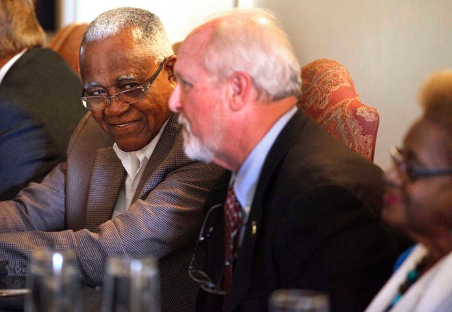 DARON.DEAN@STAUGUSTINE.COM J.T. Johnson, left, dines with St. Augustine Mayor Joe Boles and other dignitaries, including Barbara Vickers, right, at The Bayfront Hilton, the location of the former Monson motor lodge, Tuesday afternoon, June 17, 2014.