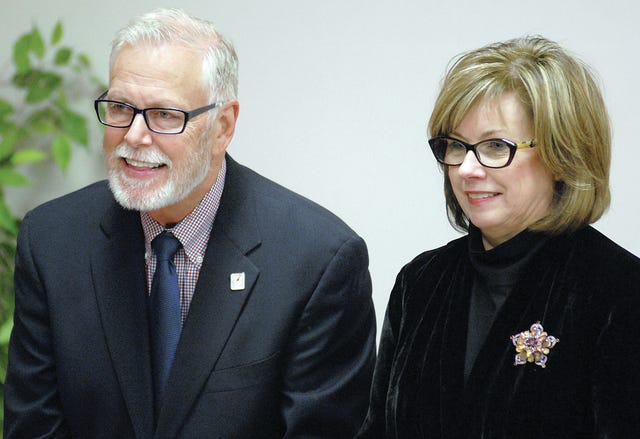 CHAD HUNTER • TIMES RECORD   /  Outgoing Fort Smith At-Large Directors Philip Merry Jr., left, and Pam Weber attend a reception Tuesday night, Dec. 16, 2014, at the Fort Smith Public Schools Service Center.