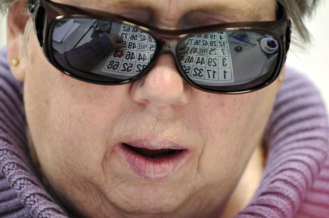 Suzanne Bold of Warminster looks to get ?Bingo? while at the Bucks County Association for the Blind and Visually Impaired in Newtown Thursday. The center is part of our "Do Gooders" series.