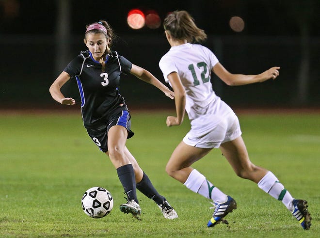Matanzas’ Claire Slamka (3) attempts to dribble by Flagler Palm Coast midfielder Josie Davis during Monday night’s game. FPC swept a pair of head-to-head meetings with the Pirates during the season.