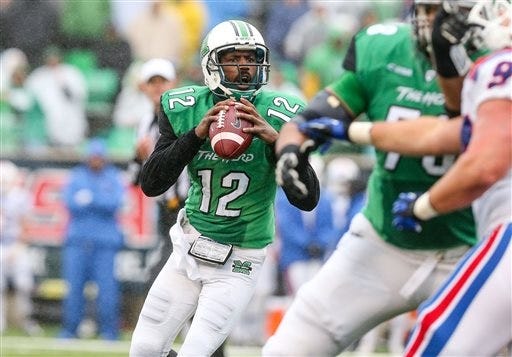 Marshall quarterback Rakeem Cato drops back to pass as the Herd takes on Louisiana Tech in their NCAA college football, C-USA Championship game on Saturday, Dec. 6, 2014, at Joan C. Edwards Stadium in Huntington, W.Va. Marshall would win the C-USA title by a score of 26-23.