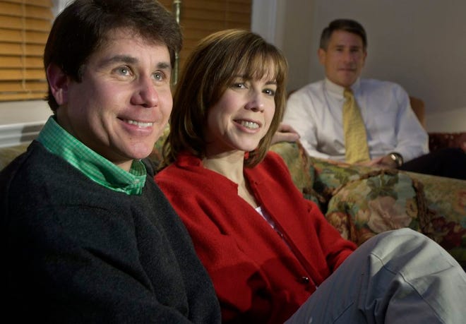 In this March 19, 2002 file photo in Chicago, Democratic gubernatorial hopeful U.S. Rep. Rod Blagojevich, left, watches election returns with his wife, Patti, and brother, Rob, at his home. Robert Blagojevich the brother of imprisoned former Illinois Gov. Rod Blagojevich offers fresh details in a new book to back his contention prosecutors used him as a pawn to get his younger sibling on charges he sought to hock President Barack Obama's old U.S. Senate seat. While charges were eventually dropped against him, the Tennessee businessman, says his refusal to turn on his brother made him "collateral damage" of an overzealous prosecution that cost his reputation, $1 million in legal bills and a still-unrepaired family split. (AP Photo/M. Spencer Green, File)