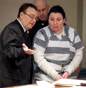 Photo by Daniel Freel/New Jersey Herald - Mirna Bolanos, of Hopatcong, speaks with her attorney David Nufrio, of the Public Defender’s office, during an appearance in State Superior Court on Monday.