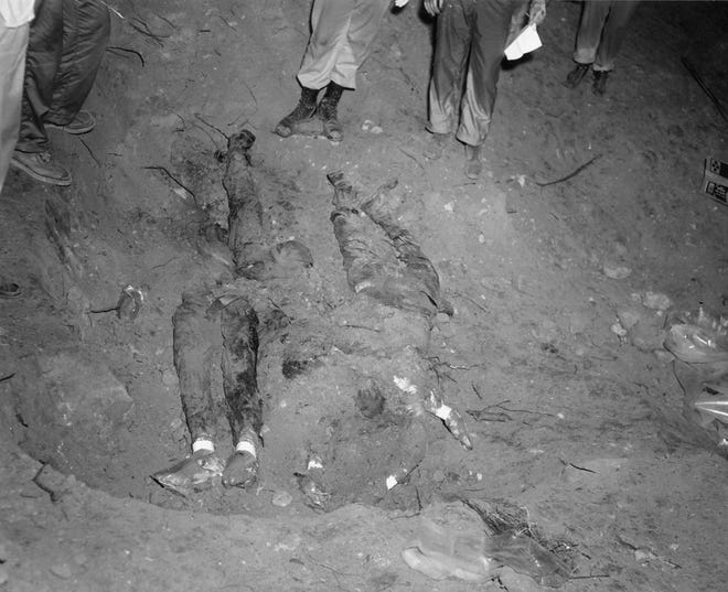 In this 1964 file photo released by the FBI, the bodies of three civil rights workers are uncovered from an earthen dam southwest of Philadelphia, Miss. The photograph was entered as evidence by the prosecution in the trial of Edgar Ray Killen, who was convicted in 2005 for three counts of manslaughter in the deaths of James Chaney, Andrew Goodman and Michael Schwerner.