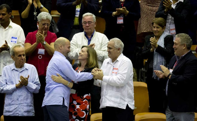 Ramon Espinosa/The Associated PressCuba's head of North American affairs, Josefina Vidal, front row center, embraces Gerardo Hernandez, a member of "The Cuban Five," on Saturday at the closing from a twice-annual legislative session at the National Assembly in Havana.