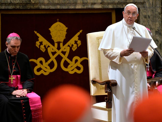 Pope Francis delivers his message during a meeting with cardinals and bishops of the Vatican Curia on the occasion of the exchange of Christmas greetings in the Clementine hall at the Vatican.
