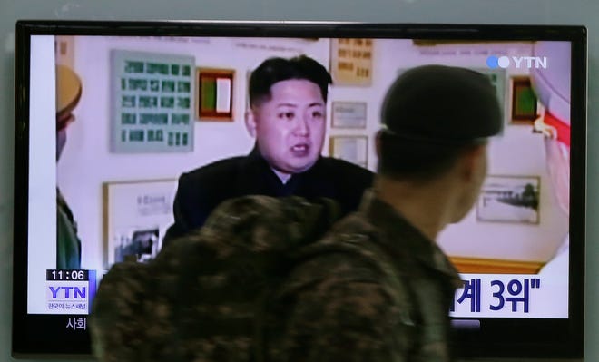 A South Korean army soldier watches a TV news program showing North Korean leader Kim Jong Un at the Seoul Railway Station in Seoul, South Korea, Monday, Dec. 22, 2014. North Korea hates the Hollywood film that revolves around the assassination of its beloved leader, but the country has had a long love affair with cinema - of its own particular styling.(AP Photo/Ahn Young-joon)