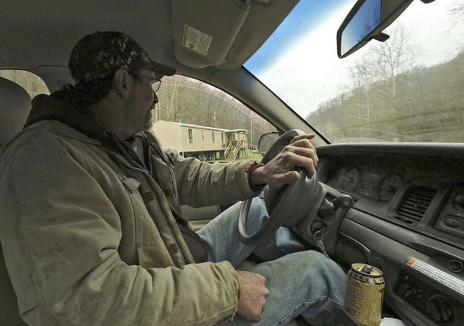 Randy Heater's family was scattered with friends and relatives across Monroe County after a gas-well leak led to evacuations. The Heaters' home is visible through the truck window.
