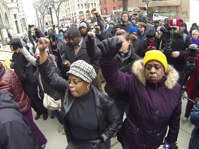 Protestors march in Milwaukee Monday, Dec. 22, 2014 after authorities announced a white Milwaukee police officer who fatally shot a mentally ill black man in April won’t face criminal charges. Milwaukee County District Attorney John Chisholm said Christopher Manney won’t be charged because he shot Dontre Hamilton in self-defense.