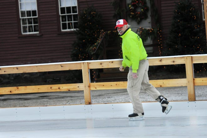 Bill Downey is working as a volunteer skating rink "guard," keeping things in order and assisting skaters as they enjoy the new outdoor rink at Strawbery Banke Museum. Photo by Deb Cram/Seacoastonline