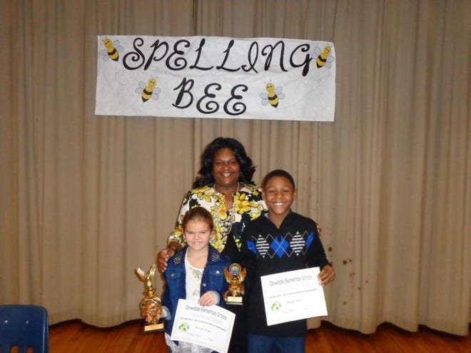 Nicole Frye, left, won the Dinwiddie Elementary School Spelling Bee on Dec. 5. She is pictured with DES principal, Danielle Moore-Winn, and 

Spelling Bee runner-up, Ryan Hite. Nicole is a fourth-grader in Mrs. Boyce’s class and Hite is a fourth-grader in Mrs. Lasher’s class. CONTRIBUTED PHOTO