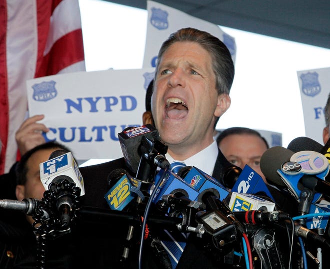 In this file photo from Oct. 28, 2011, Patrick Lynch, head of the nation'­s largest police union, speaks at a news conference in support of the police officers indicted in a ticket-fixing scandal at the Bronx Supreme Court in New York. Theatrics aren'­t a new tactic for Lynch, but an ongoing war of words with Mayor Bill de Blasio is a notch up even for Lynch, who is usually the most outspoken, the most amped up in the room. The 51-year-old has lead the Patrolmen'­s Benevolent Association since 1999 and is up for re-election next year.