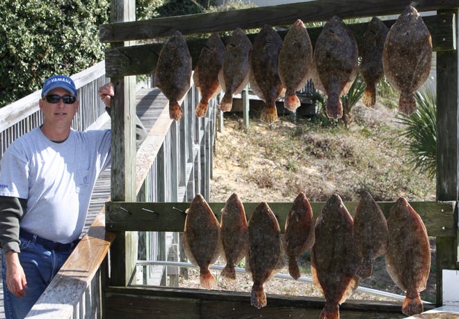 Local angler Kevin "Mac" McDaniel shows off a big catch of flounder he recently caught.