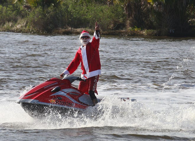 Ormond-by-the-Sea resident Charly Smarjesse dressed up as Santa Claus and boarded his jet ski to spread holiday cheer along the Halifax River on Christmas Eve.