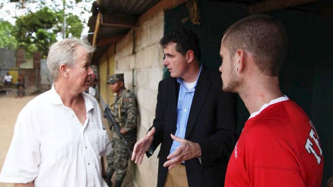 Rep. Mike Fitzpatrick (center) speaks Thursday with Aqua Quest captain Robert Mayne (left) and crew member Devon Butler inside the Puerto Lempira, Honduras, prison where the crew had been held since early May.