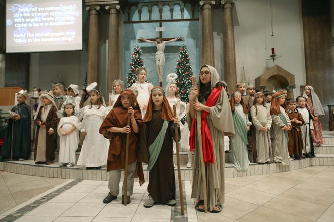 Children put on a Nativity Christmas Pageant during a Christmas Eve Mass for children at Blessed Trinity Catholic Church in Ocala, Fla. on Wednesday, Dec. 24, 2014. Hundreds of people attended several Masses held for Christmas Eve at the Catholic Church.