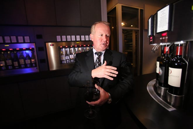 Co-owner Ralph Pressley demonstrates the Enomatic Italian wine dispensing system at Cuvee Wine & Bistro.