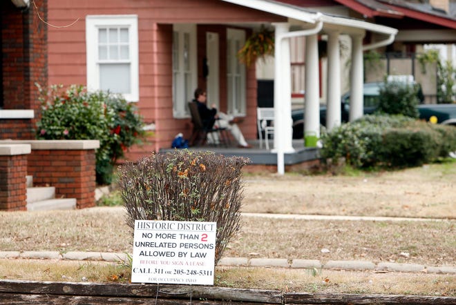 Signs are seen posted in front of a residence on Seventh Street in Tuscaloosa Monday, Dec. 22, 2014.
Michelle Lepianka Carter | The Tuscaloosa News