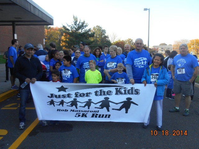 Students, parents and state Rep. Gene DiGirolamo (right) kicked off the 8th Annual Robert Massaroni Memorial 5K Run in October at Robert K. Shafer Middle School to help raise funds for the Just for the Kids Foundation.