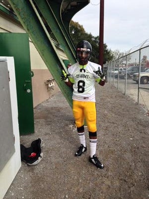 Donaldsonville High’s Jaquel Gant stands in his Rough Riders’ uniform for the U.S. Army Red Stick Bowl.
