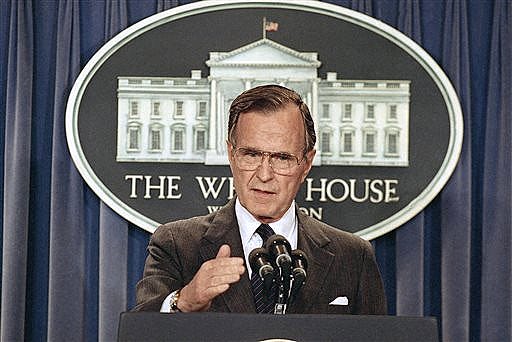 In this Thursday, May 11, 1989, file photo, President George H.W. Bush briefs reporters at the White House in Washington.