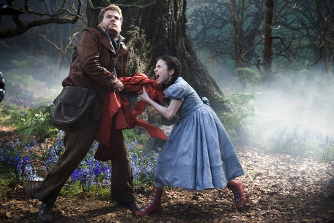 James Corden, left, as the baker and Lilla Crawford as Little Red Riding Hood in "Into the Woods."