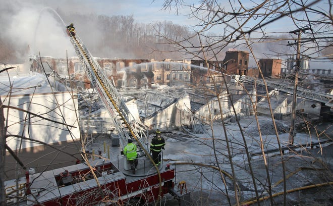 Crews fought the multiple-alarm 2012 fire on Mill Street in Cornwall. The Town Board has hired an environmental firm to inspect cleanup work done on the site in the wake of the fire, including determining if any contaminants remain in the soil. TIMES HERALD-RECORD FILE PHOTO