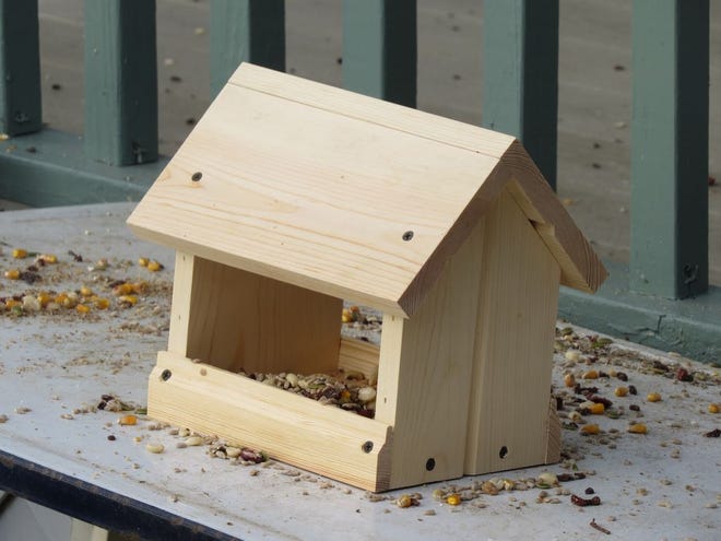 Persons who enjoy feeding the birds in the winter can assemble a bird feeder as pictured at Homestead Furniture Dec. 27. The feeders and a coupon for five pounds of birdseed from Mount Hope Hardware will be provided at no charge to the first 100 households.