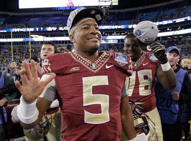 Florida State quarterback Jameis Winston (5) waves after the Seminoles beat Georgia Tech on Dec. 6 to win the Atlantic Coast Conference championship in Charlotte, N.C. Winston, whose team arrived Sunday in California for the Rose Bowl, said football is his "sanctuary" from his off-the-field troubles.