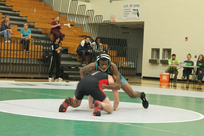 Photos provided FPC wrestler Alfred Shavers, top, placed second at the annual Bill Scott Memorial Classic meet.